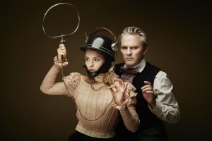 A girl with a helmet and a man standing behind her portray the characters from They Called Her Vivaldi.