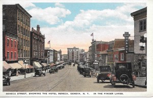Undated Postcard of Seneca St., showing early automobiles and the trolley line. From the personal collection of Chris Woodworth.