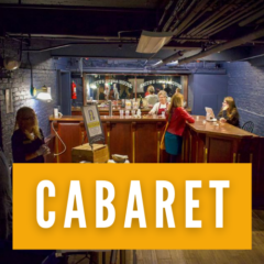 Volunteers help a patron at the Smith's cabaret