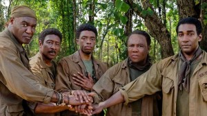 5 Black soldiers stand in the Viet Nam jungle
